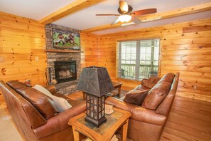 Stone Fireplace with Flatscreen TV in Living Room