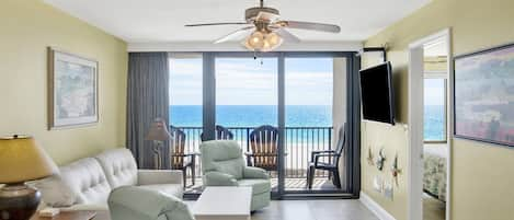 YOU can experience this BREATHTAKING view in our Living Room with a leather double sleeper sofa, 2 leather swivel/rocking recliners, 55" wall mounted Smart TV and balcony access!