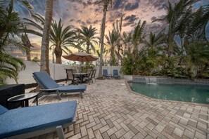 Pool deck at twilight, enjoy the tranquil sounds of the fountain.