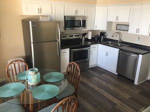 Newly remodeled kitchen with newly installed plank floors