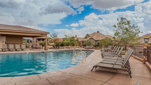 Heated pool open year round featuring seating at the pool