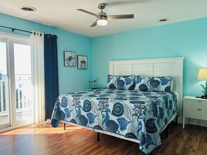Ocean view King master with a balcony and smart tv.
