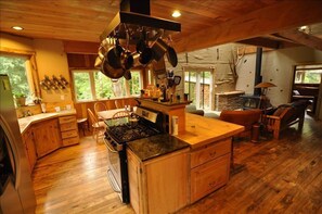 Looking into the kitchen towards the living room and spare bedroom beyond