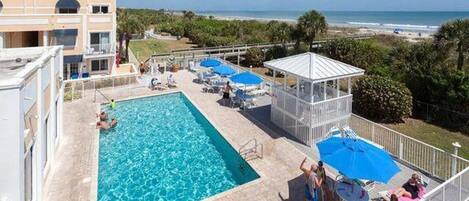 Pool area showing  proximity to the beach, building in background is ours bldg 1