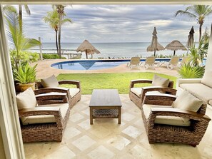 Beautiful, comfortable patio seating steps from the pool and beach.