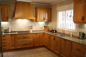 Spacious kitchen with integrated dishwasher, utility c/w washing mach & tumbler.