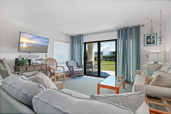 Ground floor living room with a pool view