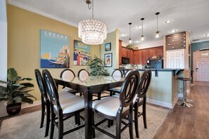 Seat up to 8 guests at the beautifully designed dining room, showcasing unique artwork