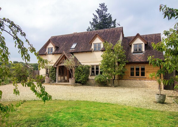 Front of cottage secure gated drive , plenty of parking and EV charger