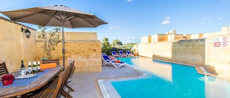 Pool area of Four Winds holiday villa in Gozo