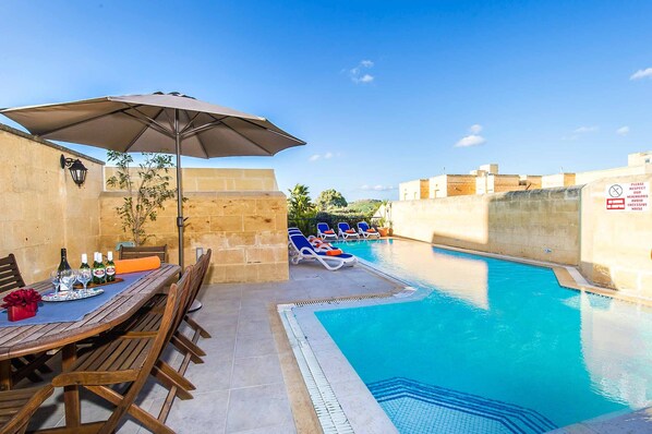 Pool area of Four Winds holiday villa in Gozo