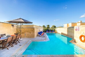 Pool area of Four Winds holiday villa in Gozo