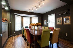 Open-concept main level with long dining table seating