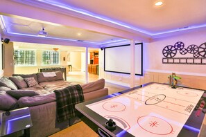 Basement with foosball, bar, projector TV, air hockey.  Perfect for gathering!