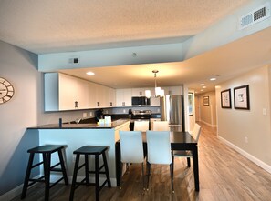 Open-concept kitchen and dining area featuring modern appliances