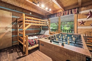 Kids will be delighted by this bunk room with its very own foosball table.
