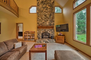 Lounge in the open living room as you warm your toes by the fire.