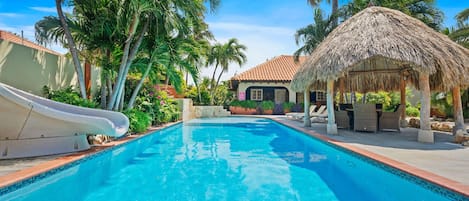Beautiful Tropical garden surrounding a huge Pool with Heated Jacuzzi