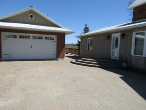 Interlocked driveway with easy access to the garage and the entrance to the house.