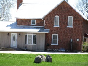 This large, spacious farmhouse in a country setting  is a great place to stay to "get away from the city!"  The original farmhouse has had a significant addition and updated renovations.