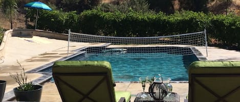 Pool area with summer grapevines