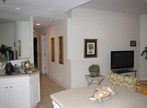 Wet bar w/mirror, 42" HD Plasma TV, tiled hallway, kitchen and all three baths