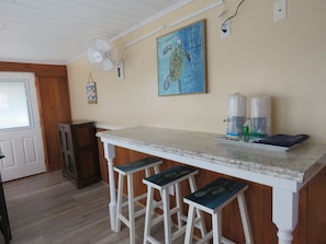 There is a bar in the kitchen area where you can eat or make a buffet