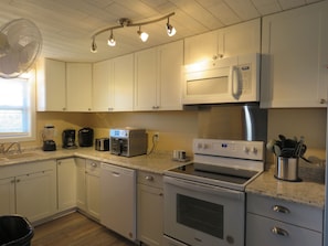 Fully stocked kitchen with a coffee maker, Keurig, and an air fryer