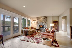 Cozy up in front of the grogeous rock faced fireplace in the living room