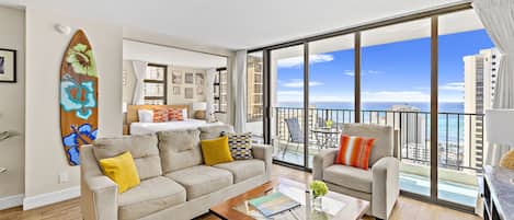 Living room with a pull-out sleeper sofa and beautiful ocean views perfect for relaxation!
