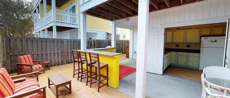 Wow, private outdoor bar, lounge area and gas grill on the ground floor.  Carolina Beachside has it all!
