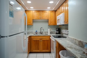 Fully Equipped Kitchen with Granite Countertops