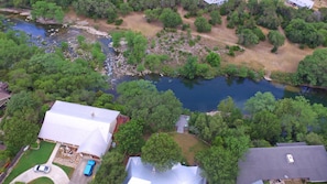 Aerial View of Backyard and Deck, with the River Below.  There is no river access.