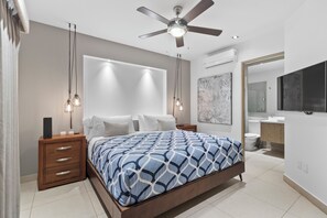 The bedroom boasts a comfortable king-size bed, ensuite bathroom and smart TV