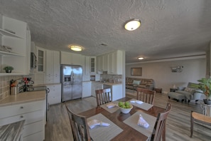 Large kitchen with breakfast table that offer views of the golf course.