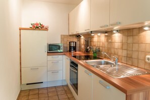 Ferienwohnung 3/1165, 80qm, Terr., Küche, 2 Schlaf-und 1 Wohnzi., max 4 P. WLAN-Küche