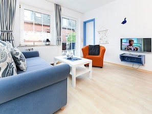 Wohnzimmer mit integriertem Küchenbereich