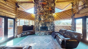 Enjoy the natural light in the living room with seating to relax during your stay.