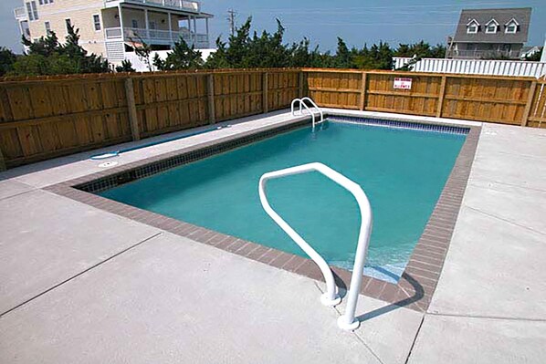 A 14' x 32' private swimming pool is a top amenity at this charming soundside cottage.