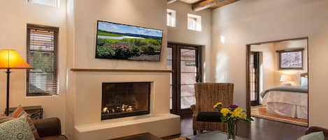 Living area with doors to patio and double pocket doors to first floor bedroom. 