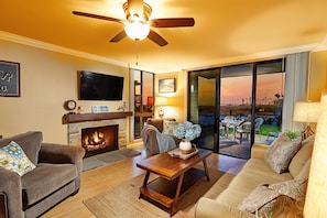 Living Room - The warm, inviting living area of Harbor View Oasis has a stone fireplace and great ocean views.