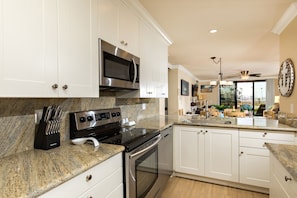 Kitchen - The fabulous granite and stainless kitchen has all new cabinets.