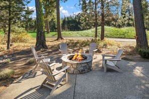 Sunset Haven: - Huge entertainment patio looking out over the golf course with a gas fire pit.