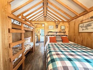 Along with the queen are two small bunkbeds for your little ones.