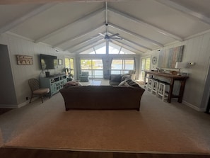 Open layout living room with great water and mountain views