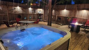 Private hot tub and fire table on the deck.