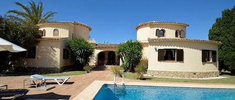 Front view of the house from the pool, a lot of space to relax