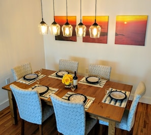 Dining table shown without extension. Can easily accommodate two more guests. 