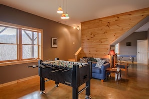 Downstairs Game Room With Foosball and Ping Pong Tables