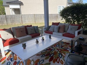 Back Patio Seating Seats 6 wth large coffee table, Pellet Grill and Green Egg